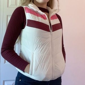 white vest with pink and maroon details